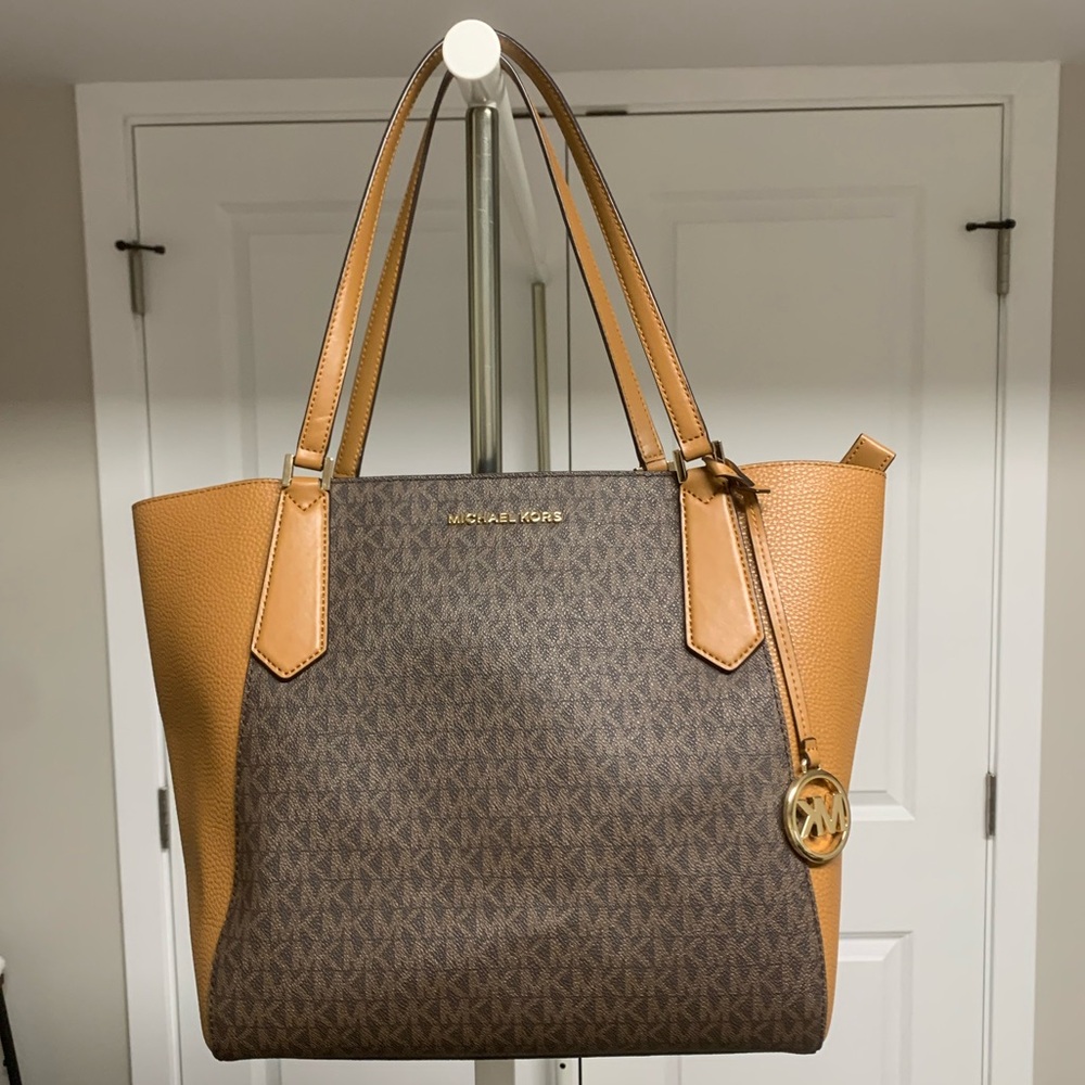 Michael Kors tote bag with zipper closure.